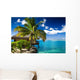 Tropical bungalow and palm tree next to amazing lagoon Wall Mural