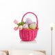 cheerful easter eggs and tulips in a pink wicker basket isolated Wall Decal