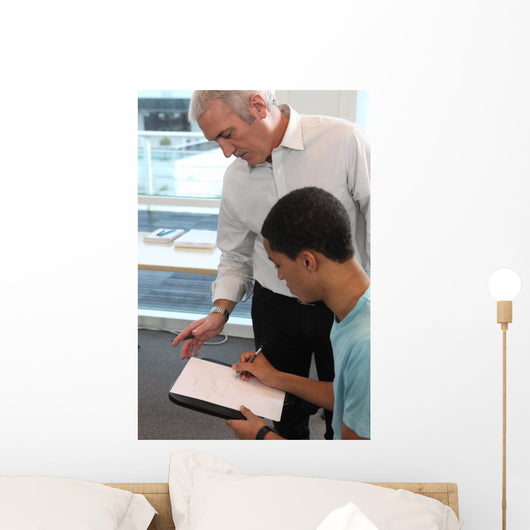 Teacher Supervising His Students