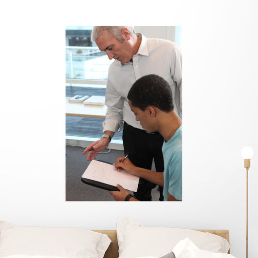 Teacher Supervising His Students