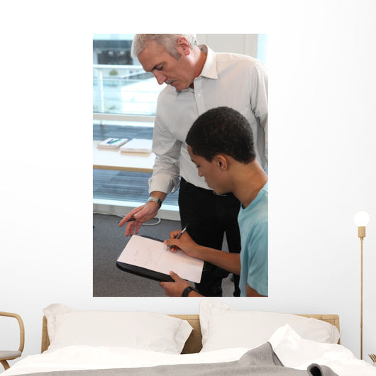 Teacher Supervising His Students