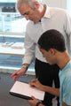Teacher Supervising His Students