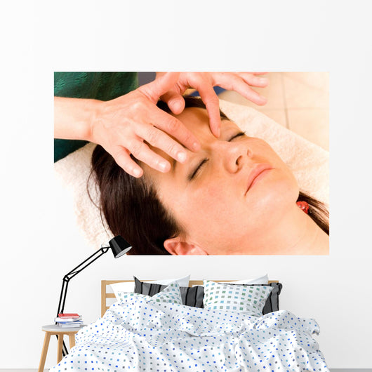 Woman Receives Facial Massage Wall Mural