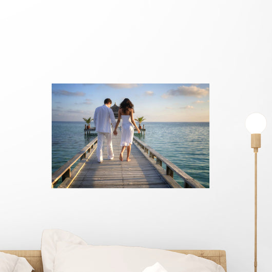 Sensual happy lovers in white clothes on the beach (Maldives) Wall Mural