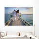 Sensual happy lovers in white clothes on the beach (Maldives) Wall Mural