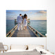 Sensual happy lovers in white clothes on the beach (Maldives) Wall Mural