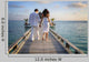 Sensual happy lovers in white clothes on the beach (Maldives) Wall Mural