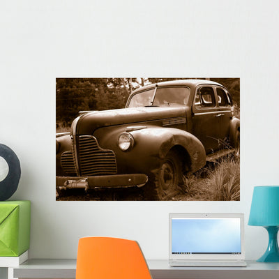 Rusty Old Car Wall Mural shown on a wall