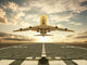 Airplane taking off at sunset Wall Mural