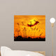 bulrushes against sunlight in sunset with a flighting birds Wall Mural