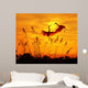 bulrushes against sunlight in sunset with a flighting birds Wall Mural