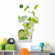 Fresh mojito drink with falling limes into glass Wall Decal