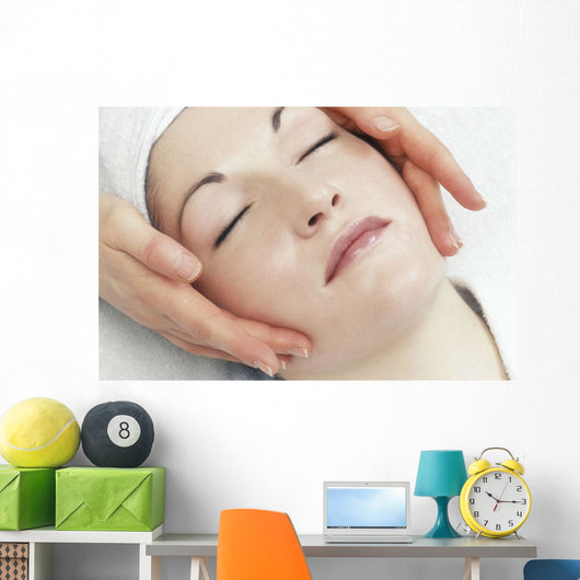 Woman Getting A Face Massage Wall Mural