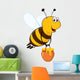 Vector happy bee flying with a brimful jar of delicious honey Wall Decal