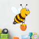 Vector happy bee flying with a brimful jar of delicious honey Wall Decal