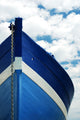 White and blue wooden boat Wall Mural