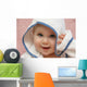 portrait of a baby with hood Wall Mural