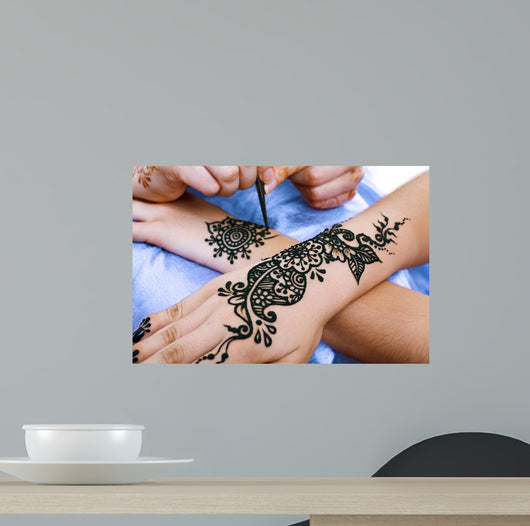 Henna Being Applied to Wall Decal