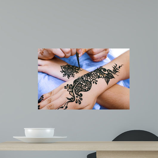 Henna Being Applied to Wall Decal