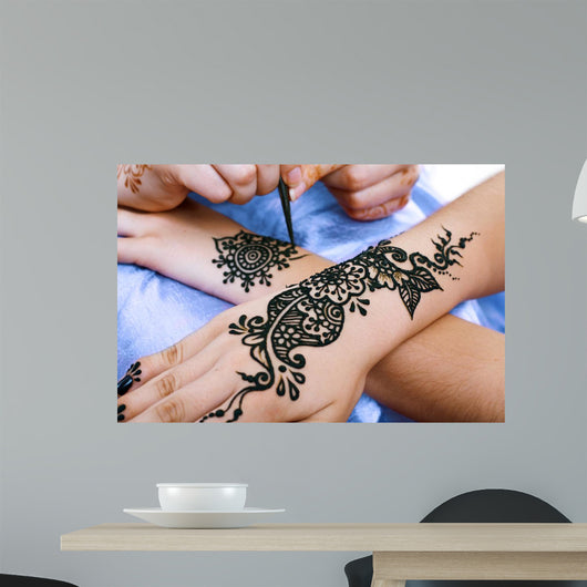 Henna Being Applied to Wall Decal