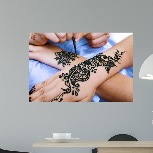 Henna Being Applied to Wall Decal