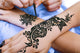 Henna Being Applied to Wall Decal