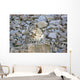 Snow Leopard Resting on a Rock Wall Decal