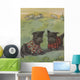 Two black Scottie dogs wearing plaid coats in grassy field Wall Mural