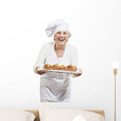 Senior Woman Cooks Muffins Wall Decal shown on a wall