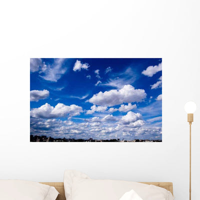 Ciel Bleu Nuageux Wall Decal shown on a wall