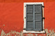 Red Wall and Shuttered Window Wall Decal