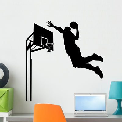 Dunking a Basketball Silhouette Wall Decal shown on a wall
