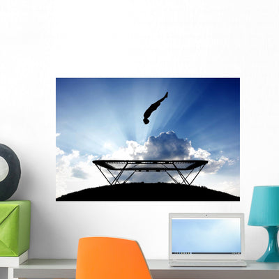 Silhouette Gymnast Trampoline Sunset Wall Decal shown on a wall