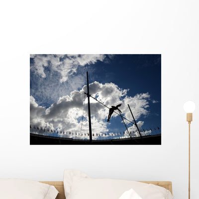 Pole Vaulter Against the Sky Wall Decal shown on a wall