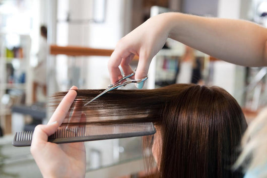 Hairdresser Cutting Clients Hair