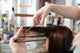Hairdresser Cutting Clients Hair
