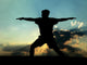 Silhouette of Man Practicing Yoga Wall Mural
