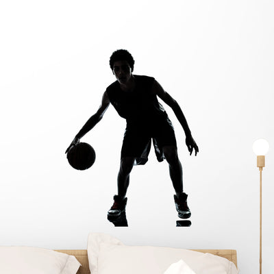 Basketball Player Silhouette Wall Mural shown on a wall