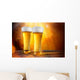 Beer in a glasses with gold background Wall Mural