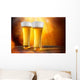 Beer in a glasses with gold background Wall Mural