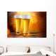 Beer in a glasses with gold background Wall Mural