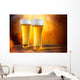 Beer in a glasses with gold background Wall Mural