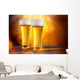 Beer in a glasses with gold background Wall Mural