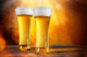 Beer in a glasses with gold background Wall Mural