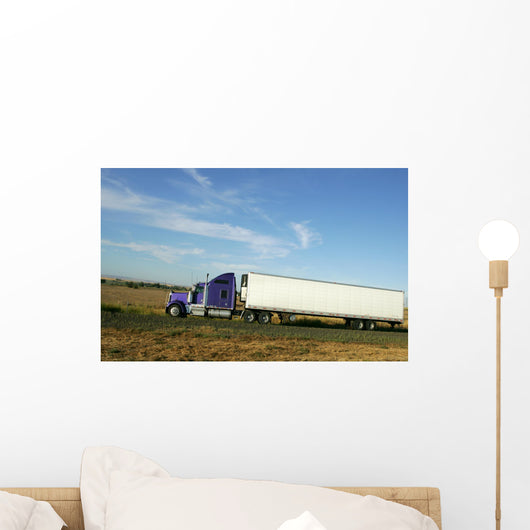 Semi truck going fast on interstate highway Wall Mural