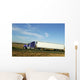 Semi truck going fast on interstate highway Wall Mural