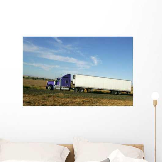 Semi truck going fast on interstate highway Wall Mural