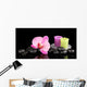 Spa stones with orchid flower and candles isolated on black Wall Mural