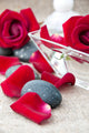 Spa Stones and Rose Petals on a Light Background Wall Mural