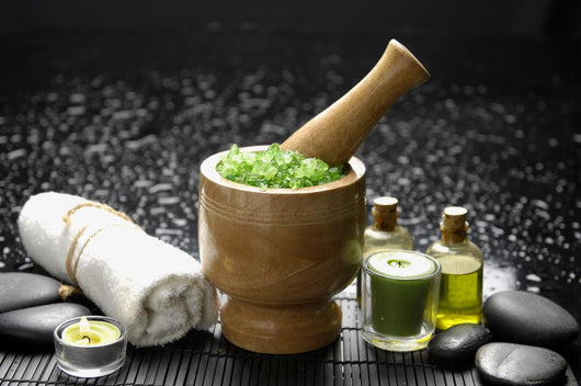 Wooden Mortar and Pestle with Towel and Massage Oil Wall Mural